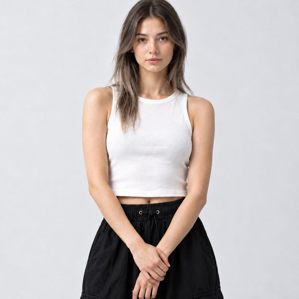 Black wide-leg parachute cargo pants worn, cropped to show the drawstring waistband and front pleating.