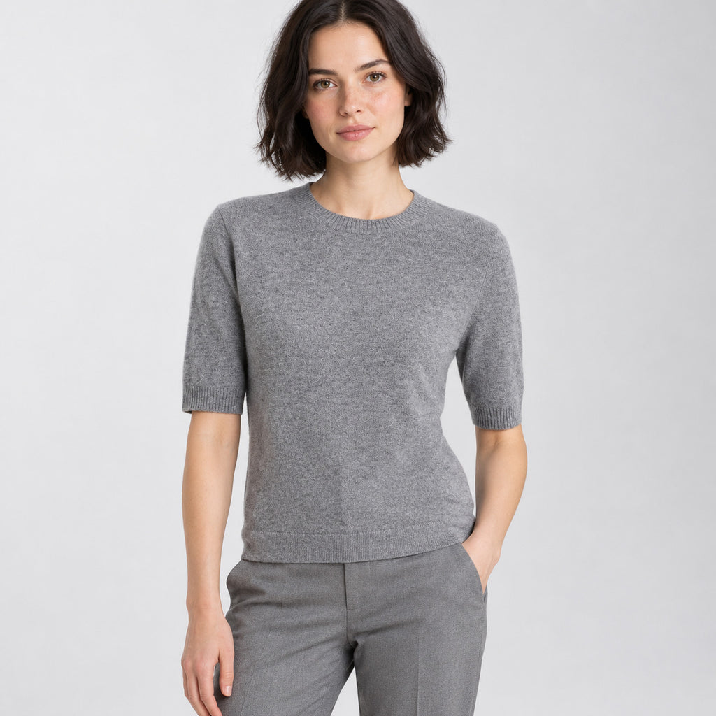 Heather gray crewneck half-sleeve sweater worn by a model in a neutral studio.